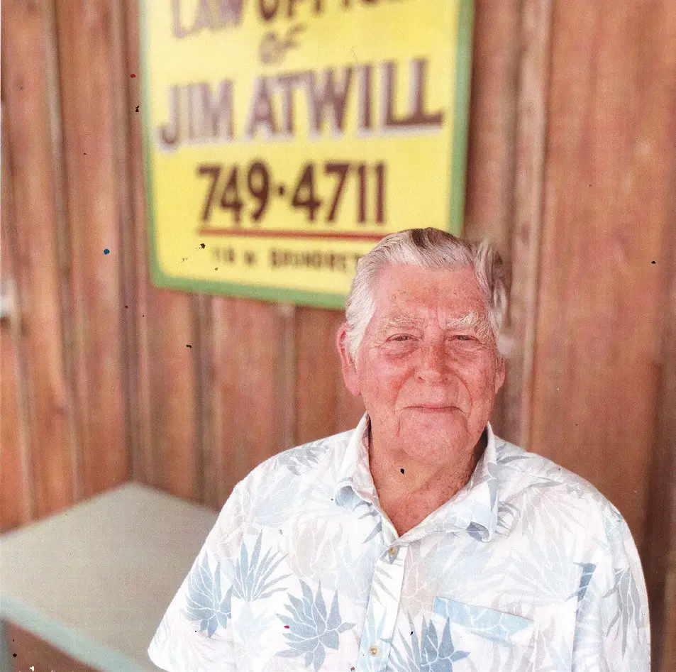 Jim Atwill sits outside his law office, located in a cottage at 118 W. Brundrett Ave. in Port Aransas. Courtesy photo