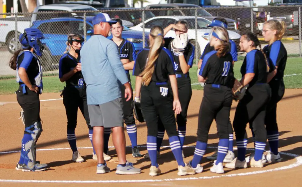 Port Aransas High School softball coach Jonathan Sheffield talks to his players during a game against Refugio on Friday, April 8. Staff photo by Dan Parker