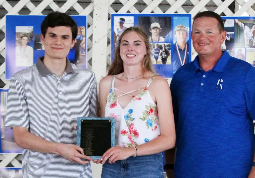 The Millie Wise Sportsmanship Awards went to seniors Stefan Deason, left, and Avica Burrill during the Port Aransas High School Athletic Banquet on Monday, May 9. At right is Steve Reaves, athletic director. Courtesy photo by Jeff Moss